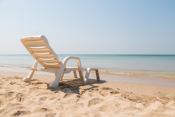 Beach chair at sunny coast at the beach