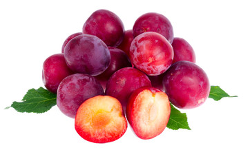 Heap of sweet red plums isolated on white background