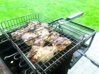 Chunks of meat and vegetables are grilled