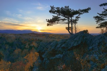 Autumn sunset in the mountains. Mountain ridge Khekhtsir.  Bolshekhekhtsirsky Nature Reserve. Khabarovsk region, far East, Russia. 
