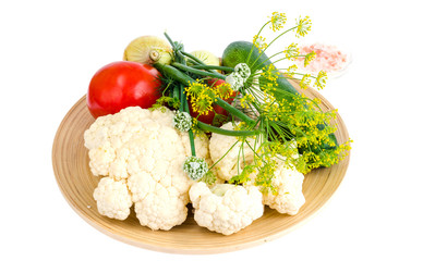 Homemade organic seasonal vegetables on wooden plate