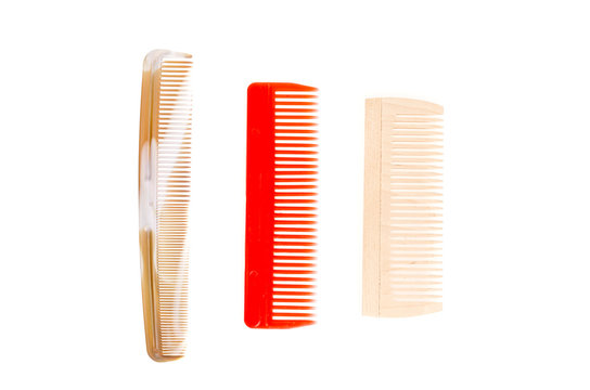 Three colored hair combs. Studio Photo