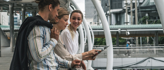 caucasian businesspeople standing together and having business discussion