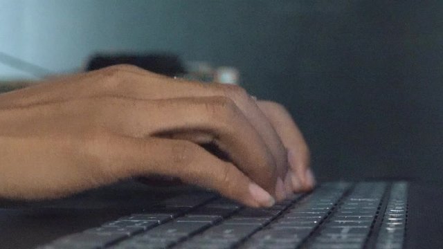 Low Close Shot of Female Hands Typing on a Laptop Computer