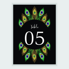 Table number card with peacock feather