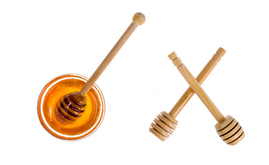 Wooden spoons for honey isolated on white background.