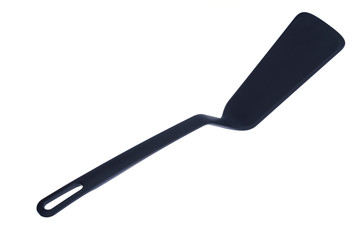 Plastic kitchen spatula for the pan. Photo