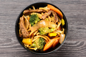 bowl with yakisoba on table
