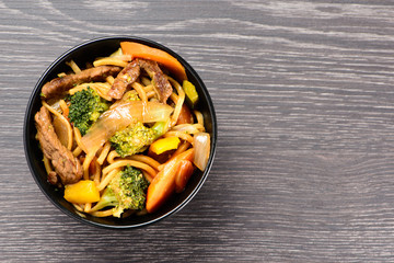 bowl with yakisoba on table