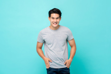 Handsome smiling friendly Asian man in plain t-shirt