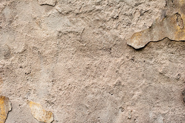 Texture of a concrete wall with cracks and scratches which can be used as a background