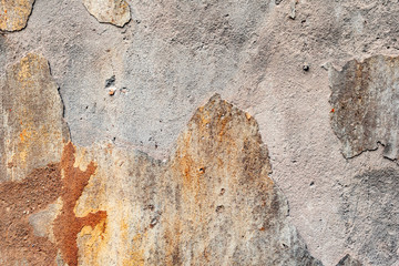 Texture of a concrete wall with cracks and scratches which can be used as a background