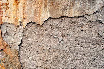 Texture of a concrete wall with cracks and scratches which can be used as a background