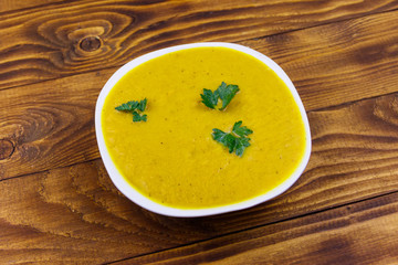 Pumpkin soup on a wooden table