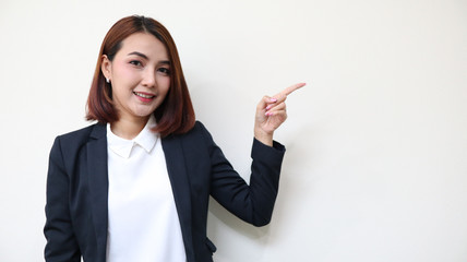 business woman pointing up over white background