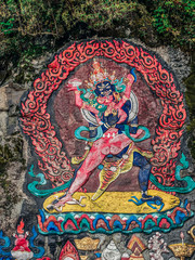 Tibetan murals in the stone wall carvings of Dongga Temple, Hailuogou, Sichuan, China, Thangka, rock carving © Liu Lei