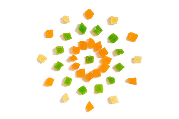 Pattern of Nuts - candied dried pineapple yellow, orange and green on a white background in the form of a circle. Concepts about decoration, healthy eating and food background.