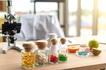 Medicine bottles and microscopes on the doctor's desk