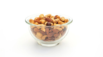 Baked mixed nuts in a bowl on a white background.