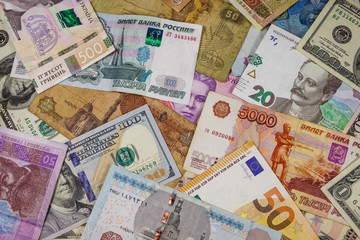 Multicurrency background of euros US dollars, Russian rubles, Egyptian pounds and Ukrainian hryvnias