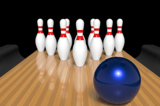 A bowling ball rolling target a bowling pin concept