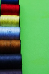 threads and needles on the background with patterns, accessories for cutting and sewing, womens hobby, tailoring