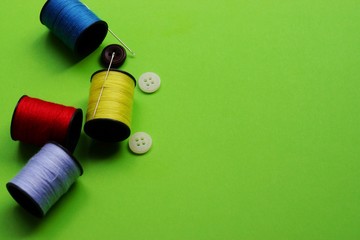 threads and needles on the background with patterns, accessories for cutting and sewing, womens hobby, tailoring