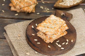 Delicious cookies with seeds on a wooden Board on a wooden table