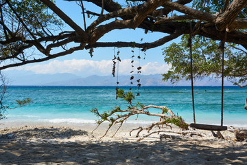 TRAWANGAN, INDONESIA - AUGUST.15.2019: Swing at the beach on Gili trawangan.