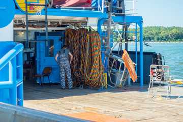 Checking equipment for underwater operations. arches Repair and rescue ship. Hoses for work under water.