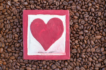 Coffee beans with a white and red heart symbolise not only health, but of the love of coffee.