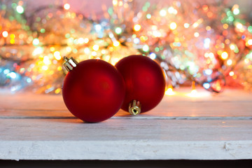 New Year. Red balls to decorate the Christmas tree. Bokeh on the background.