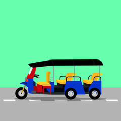 Three-wheeled tuk-tuk taxi on he road. 