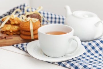 Homemade crunchy cookies and  tea on a wooden table
