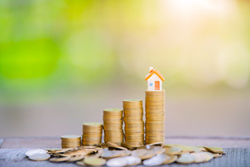 Coins stack for saving money and financial planning concept, saving to buy a house