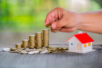 Coins stack for saving money and financial planning concept, saving to buy a house
