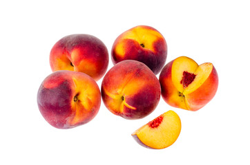 Several ripe sweet peaches isolated on white background.