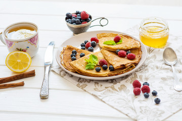 breakfast pancakes with blueberries and raspberries healthy food lemon tea