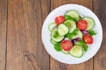 Chopped fresh vegetables on white plate. Studio Photo
