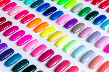 Samples of nail Polish concept. Multicolored trendy beauty pattern. Nail varnish. Fashion, style. Autumn manicure. Fashionable shellac colors red, yellow, blue, pink