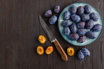 fresh ripe Plums in dish on table
