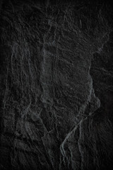 Dark grey black slate background or texture. black stone