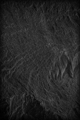 Dark grey black slate background or texture. black stone