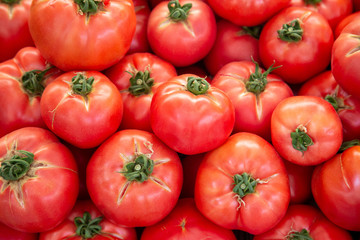 Organic tomatoes at the fam maket. Background with copy space.