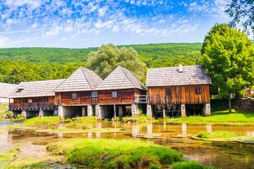 Fototapeta na wymiar Croatia, countryside in region of Lika, Majerovo vrilo river source of Gacka, traditional village, old wooden mills and cottages