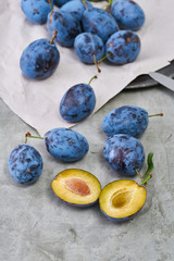Raw organic plums in a on a vintage background