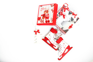 decorative box with wooden Christmas tree toys. Christmas tree, Snowman, skates, mitten. Isolated on white background, close-up