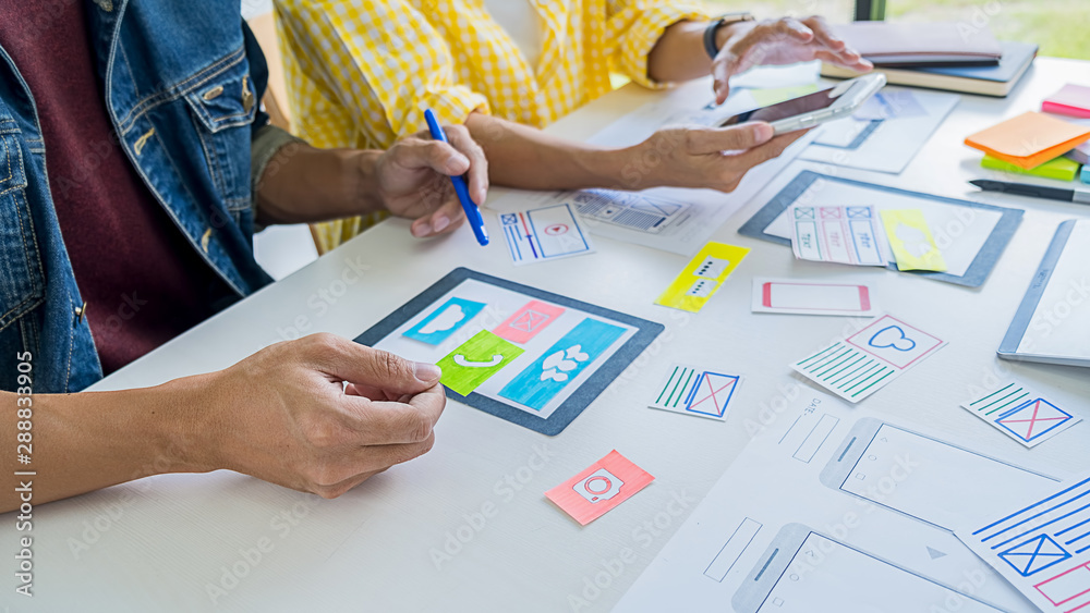 Wall mural creative web designer planning application and developing template layout, framework for mobile phon