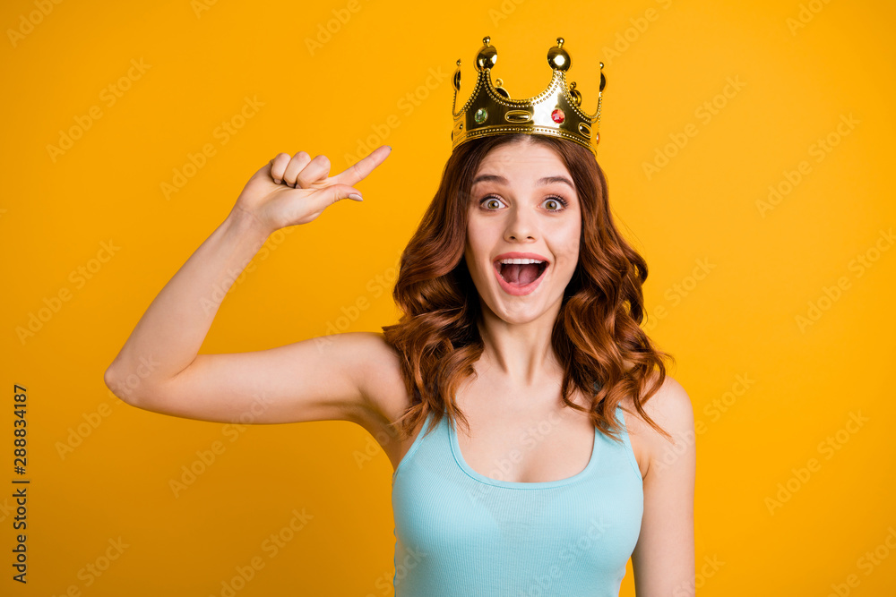 Sticker Photo of foxy lady indicating finger on big golden headwear wear tank-top isolated yellow background