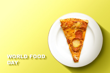 Slice of pizza on the plate with World Food Day text on a colored background